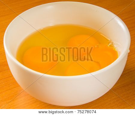 The Breaks Egg In A Cup