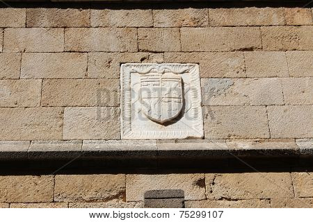 ancient wall with the arms