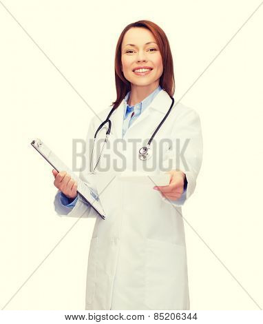 healthcare and medicine concept - smiling female doctor with clipboard and stethoscope