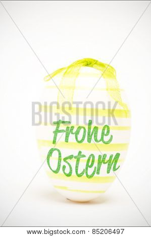 frohe ostern against green easter egg