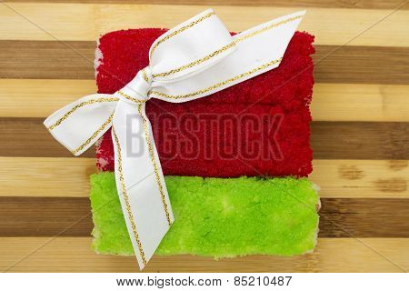 Rolls With Bow Cutting Board On A White Background
