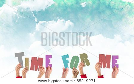 Hands holding up time for me against green and blue sky