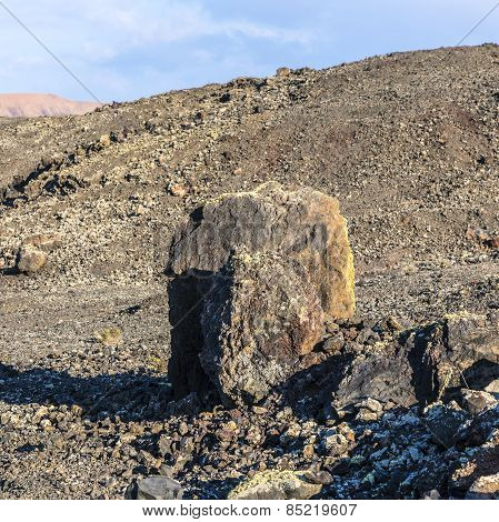Volcanic Bomb In Front Of Volcano Montana Colorada In Lanzarote, Tinajo