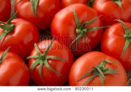 red tomatoes background. Group of tomatoes