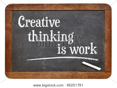 Creative thinking is work - creativity concept - text on a vintage slate blackboard
