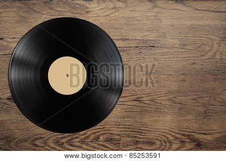 vynil record disc on wooden table