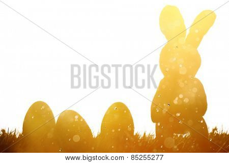 Easter bunny and eggs on meadow,Multi exposure.