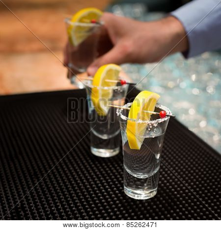 Three Tequila Shots With Lemon