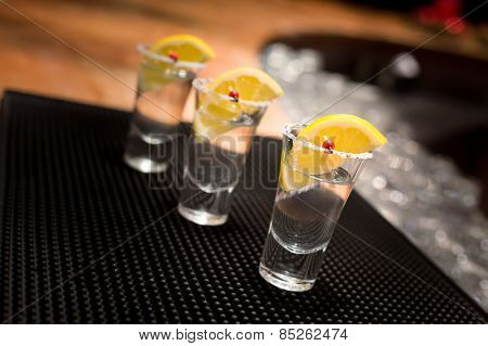 Three Tequila Shots With Lemon