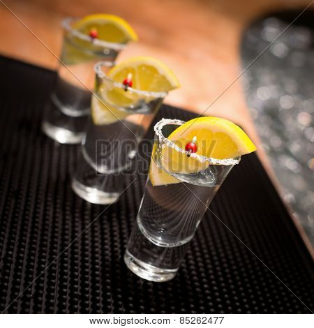 Three Tequila Shots With Lemon