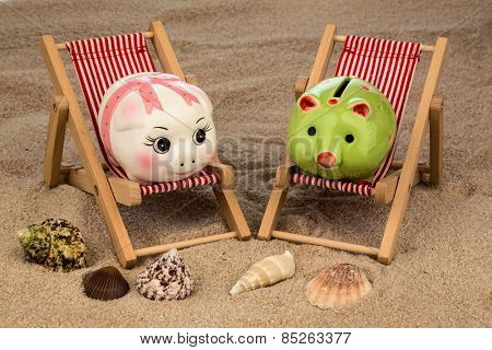 beach chair with piggy bank on the sandy beach. symbolic photo for cost of travel, vacation, holidays. save on vacation