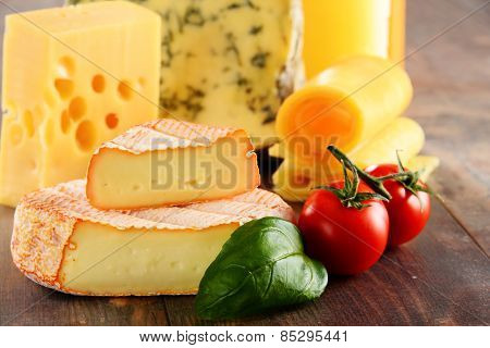 Different Sorts Of Cheese Isolated On Kitchen Table