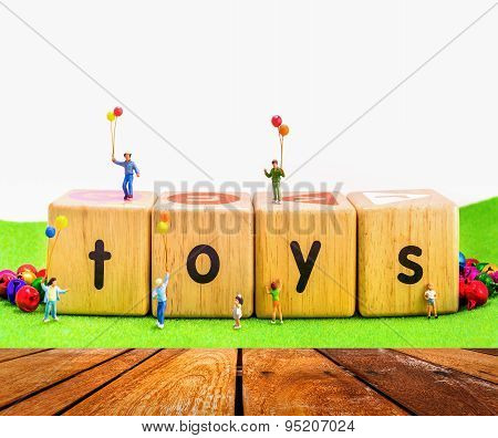 Image Of Mini Figure Kids Dolls Hold Balloon Playing On Toys Wooden  Blocks .