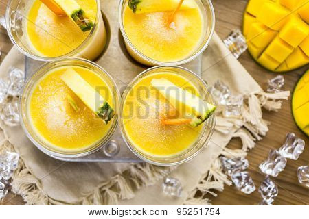 Homemade low calorie popsicles made with mando pineapple and cocconut milk.