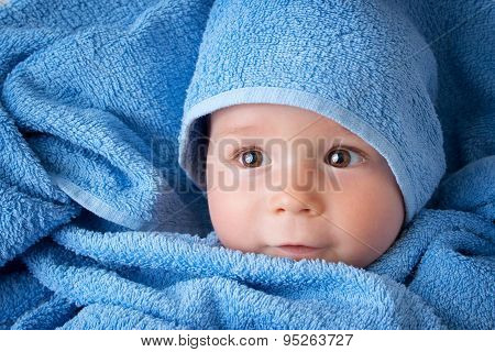 Cute baby in a towel