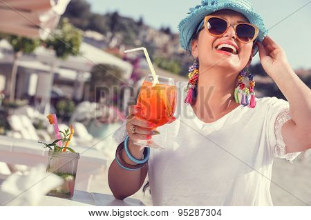 Woman holding glass of cocktail