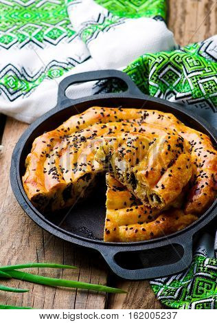 Vertuta - spinach feta spiral traditional Moldavian pie. style rustic. selective focus