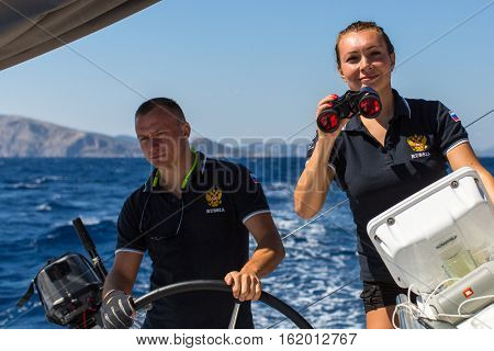 HYDRA, GREECE - SEP 28, 2016: Sailors participate in sailing regatta 16th Ellada Autumn 2016 among Greek island group in the Aegean Sea, in Cyclades and Saronic Gulf.