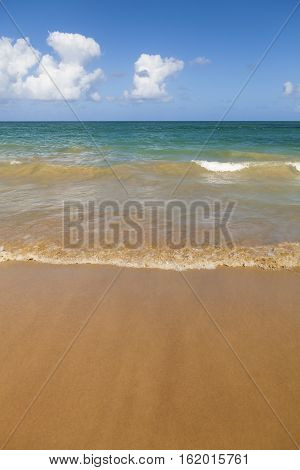Tropical Caribbean beach with sand water and blue sky. Shot in Puerto Rico.