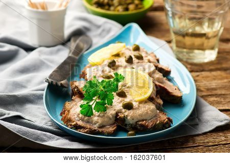 Vitello tonnato . selective focus. style rustic