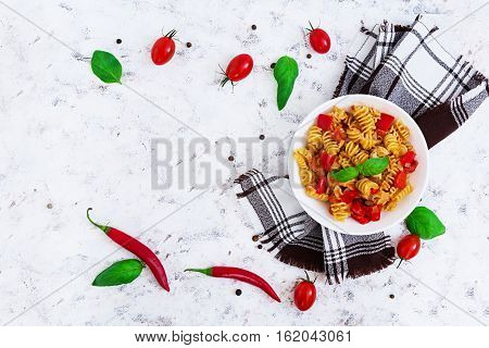 Radiatori Pasta With Chicken And Peppers On White Background. Top View