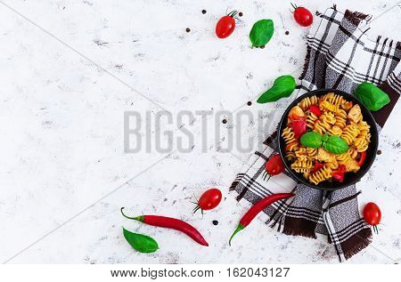 Radiatori Pasta With Chicken And Peppers On White Background. Top View