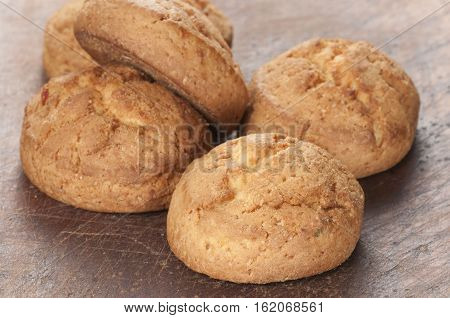 Cakes with succade oa timber board close up