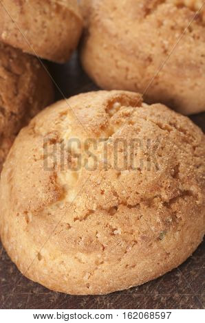 Cakes with succade oa timber board close up