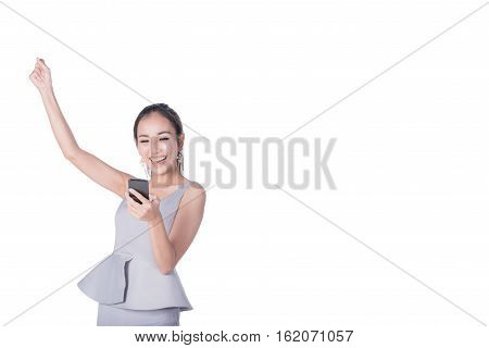 Potrait of young happy beautiful Asian woman arm up to celebrat and excite while holding smartphone mobile. Image with clipping path
