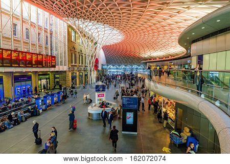 LONDON UNITED KINGDOM - OCTOBER 31: This is the interior of Kings Cross station where passengers come to view the departure and arrival board on October 31 2016 in London