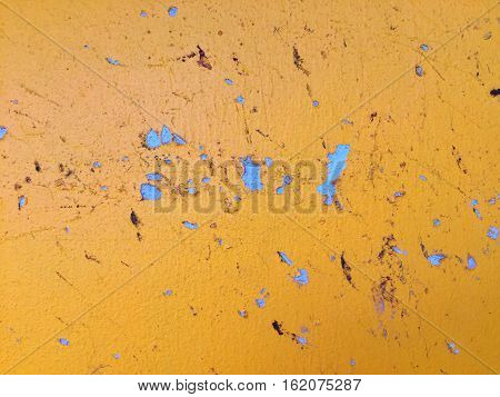 Grunge yellow cement crack wall texture background.