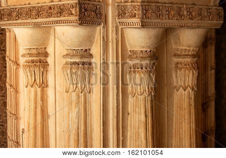 Intricate pillars architecture on historic Paigah tombs walls in India