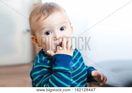 Child finger takes sugar and eat it delicious and fun