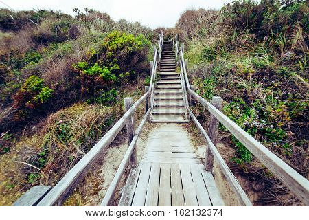 Steps leading down to beach at .Torndirrup National Park Albany Western Australia Australia.vintage toning filter add .