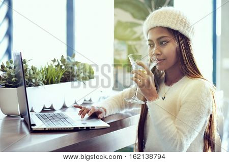Beautiful asian girl blogger in a cafe