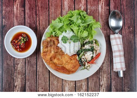 Rice Topped Stir - Fried Spicy Basil With Crad And Minced-pork Omelet.