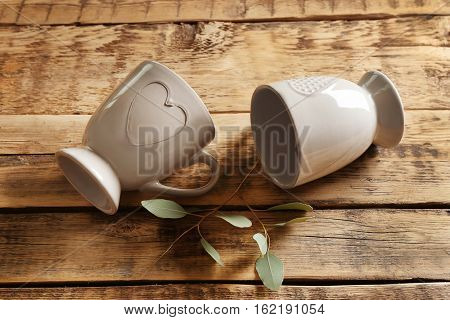 Two cups on wooden table