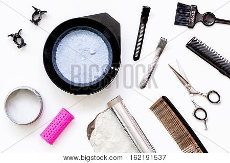 Tools for hair dye and hairdye top view on white background