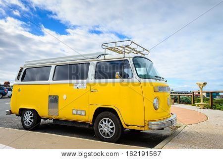 Adelaide Australia - August 14 2016: Classic yellow Volkswagen Transporter camper van parked on a street at Middleton beachfront