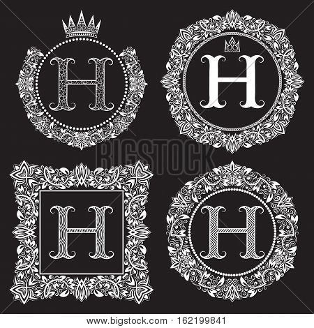 Vintage monograms set of H letter. Heraldic coats of arms in wreaths round and square frames. White symbols on black.