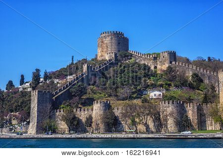 ISTANBUL - APRIL 16 2015: Rumelihisari also known as Rumelian Castle and Roumeli Hissar Castle is a fortress located in Istanbul Turkey on a hill at the European side of the Bosphorus