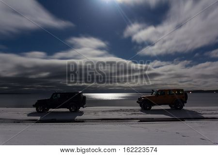Karelia, Russia, 10 Dec 2016 check out the Jeep Wrangler club on lake Ladoga, the Jeep Wrangler is a compact four wheel drive off road and sport utility vehicle