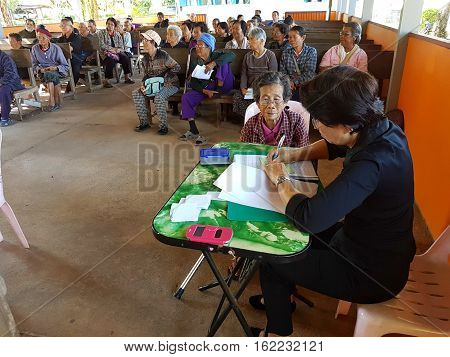 CHIANG RAI THAILAND - DECEMBER 19 : Unidentified female asian doctor diagnose old woman suffering from leprosy on December 19 2016 in Chiang rai Thailand.