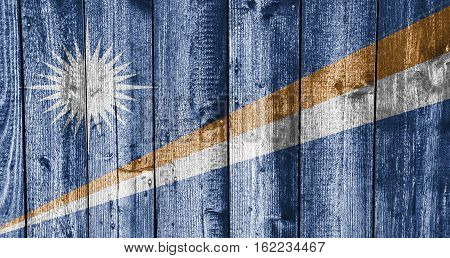 Flag Of The Mashall Islands On Weathered Wood