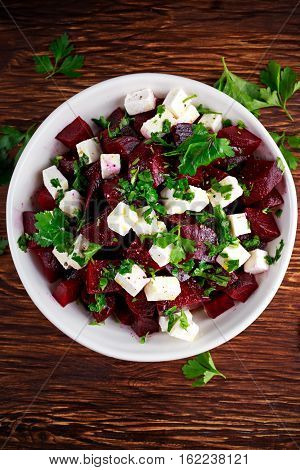 Healthy beetroot, feta cheese salad with parsley.