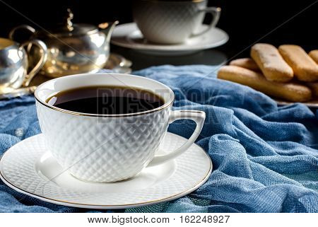 Tea In A White Cup. A Dark Photo.