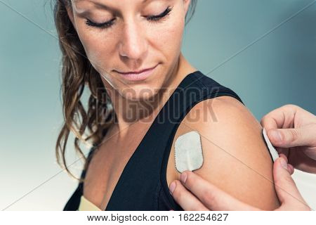 Electrodes Of Tens Device On Human Shoulder