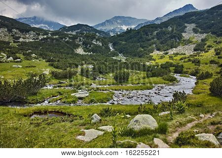 Mountain river and clouds over banderishki chukar peak, Pirin Mountain, Bulgaria