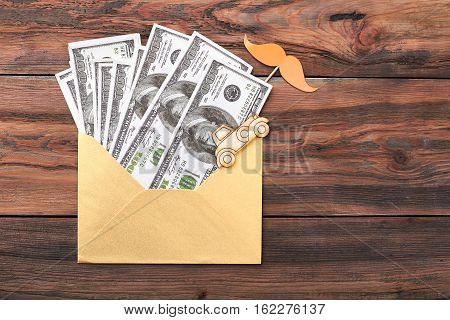 Props mustache and dollars. Envelope and pyrography car. Money as business foundation.