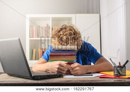 Blone guy hiding behind  a colorful page 